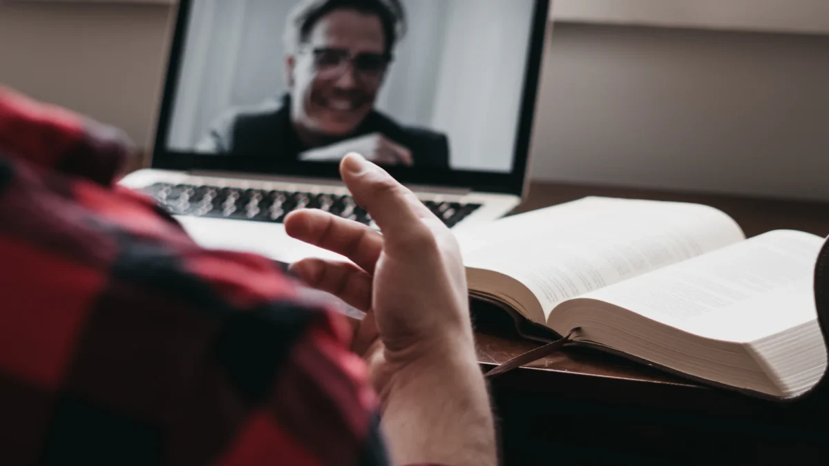 Online Course Platforms Compared: 5 Options, Fees and Best Fit 2 Student watching an online course lesson on a laptop with a notebook